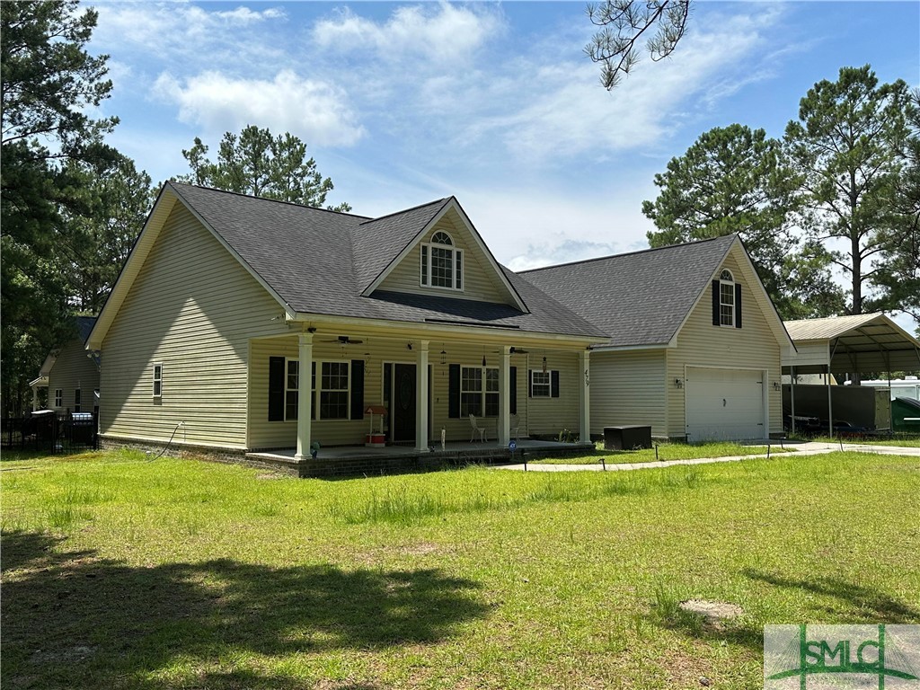 479 Shearouse Road Guyton, GA 31312 - Photo 3 of 32 Side View showing In-Law Suite in Rear and Covered