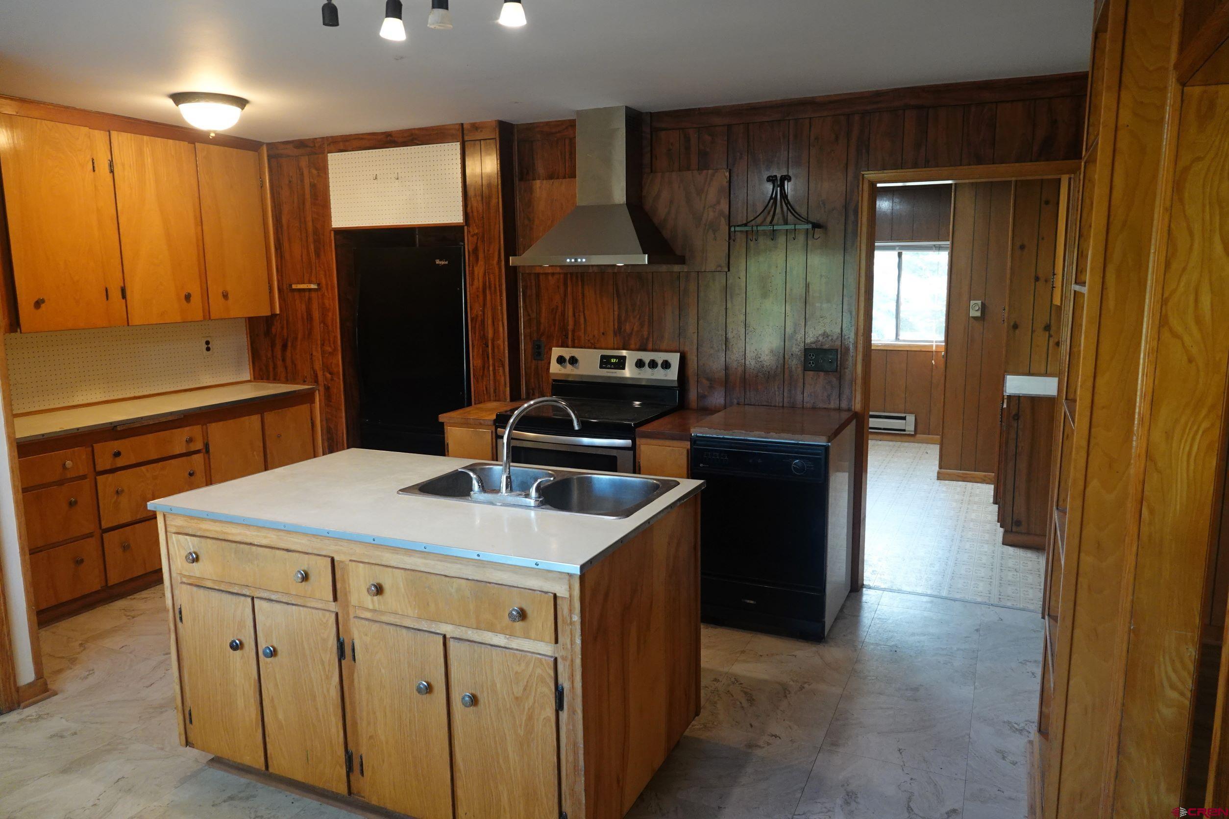 15835 Black Bridge Road Paonia, CO 81428 - Photo 19 of 35 a kitchen with a sink and refrigerator