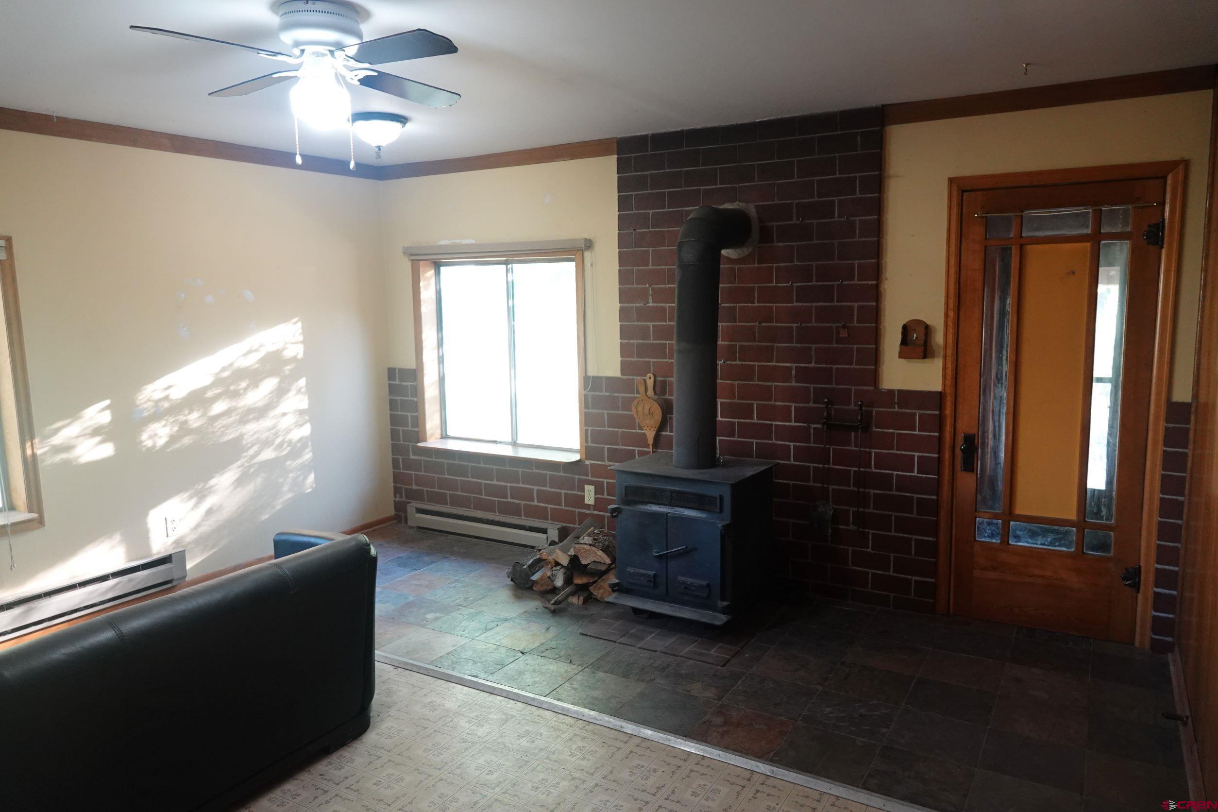 15835 Black Bridge Road Paonia, CO 81428 - Photo 22 of 35 a living room with furniture and a window