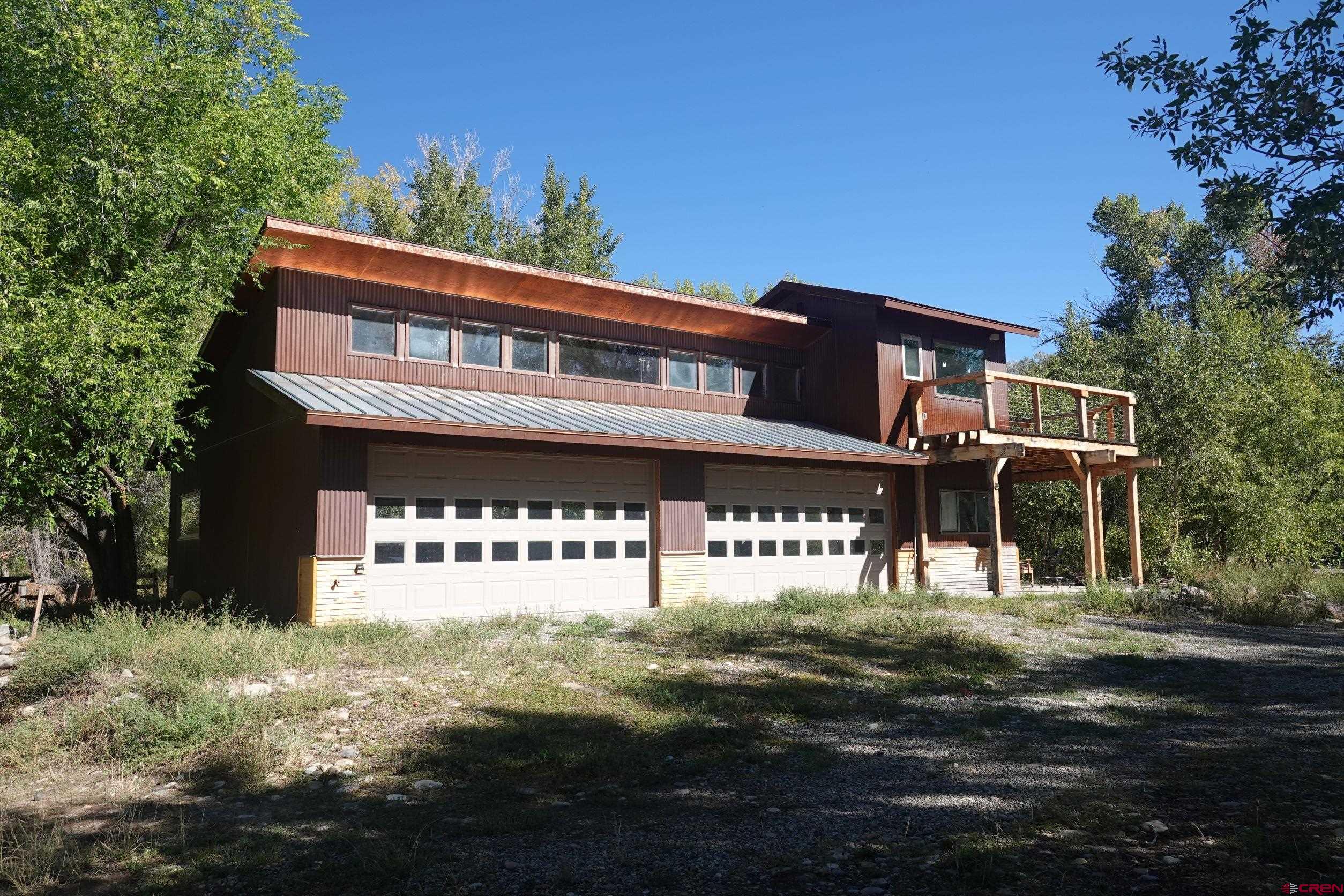 15835 Black Bridge Road Paonia, CO 81428 - Photo 25 of 35 a front view of a building with garden