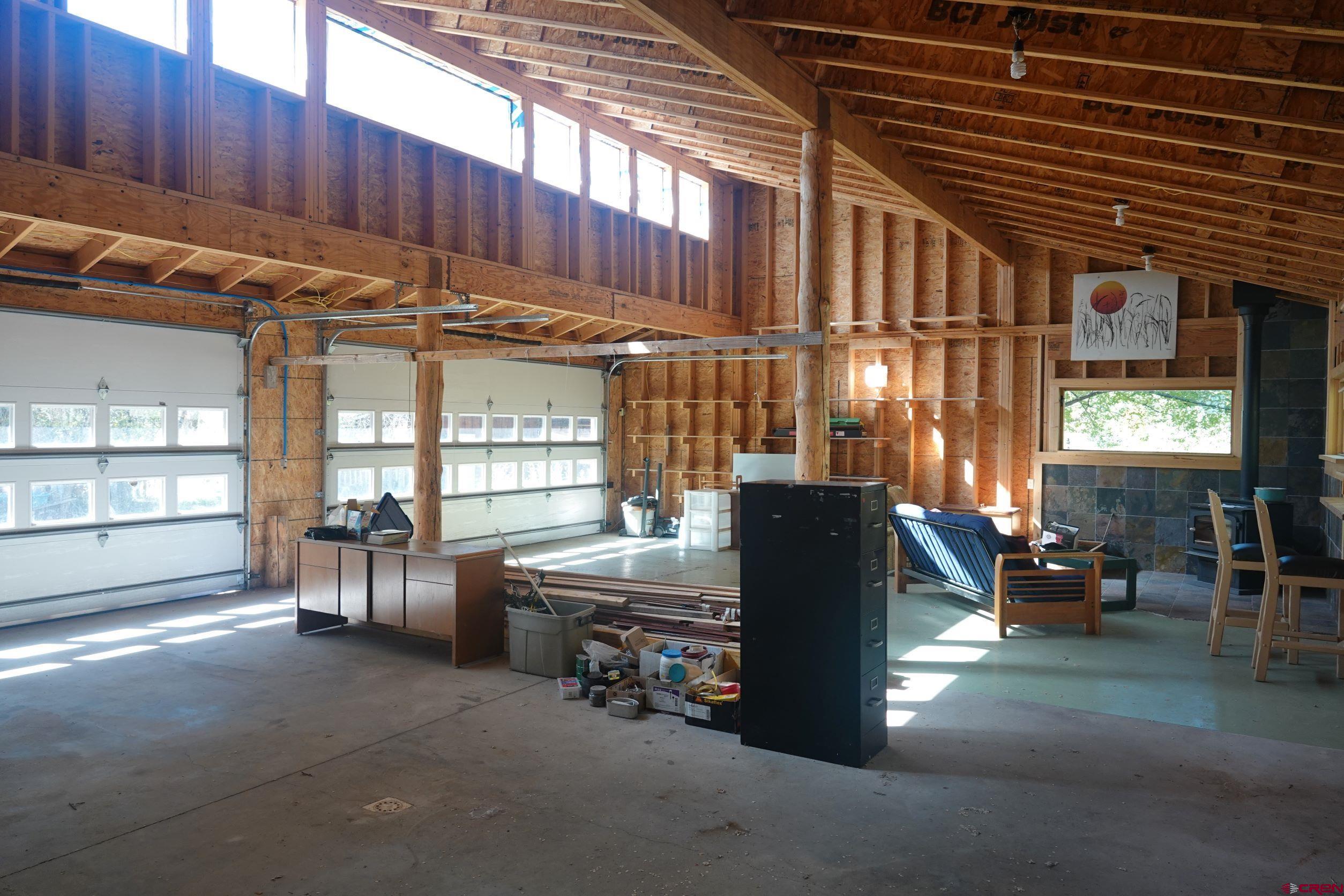 15835 Black Bridge Road Paonia, CO 81428 - Photo 27 of 35 a view of a chairs and table in the back yard of the house