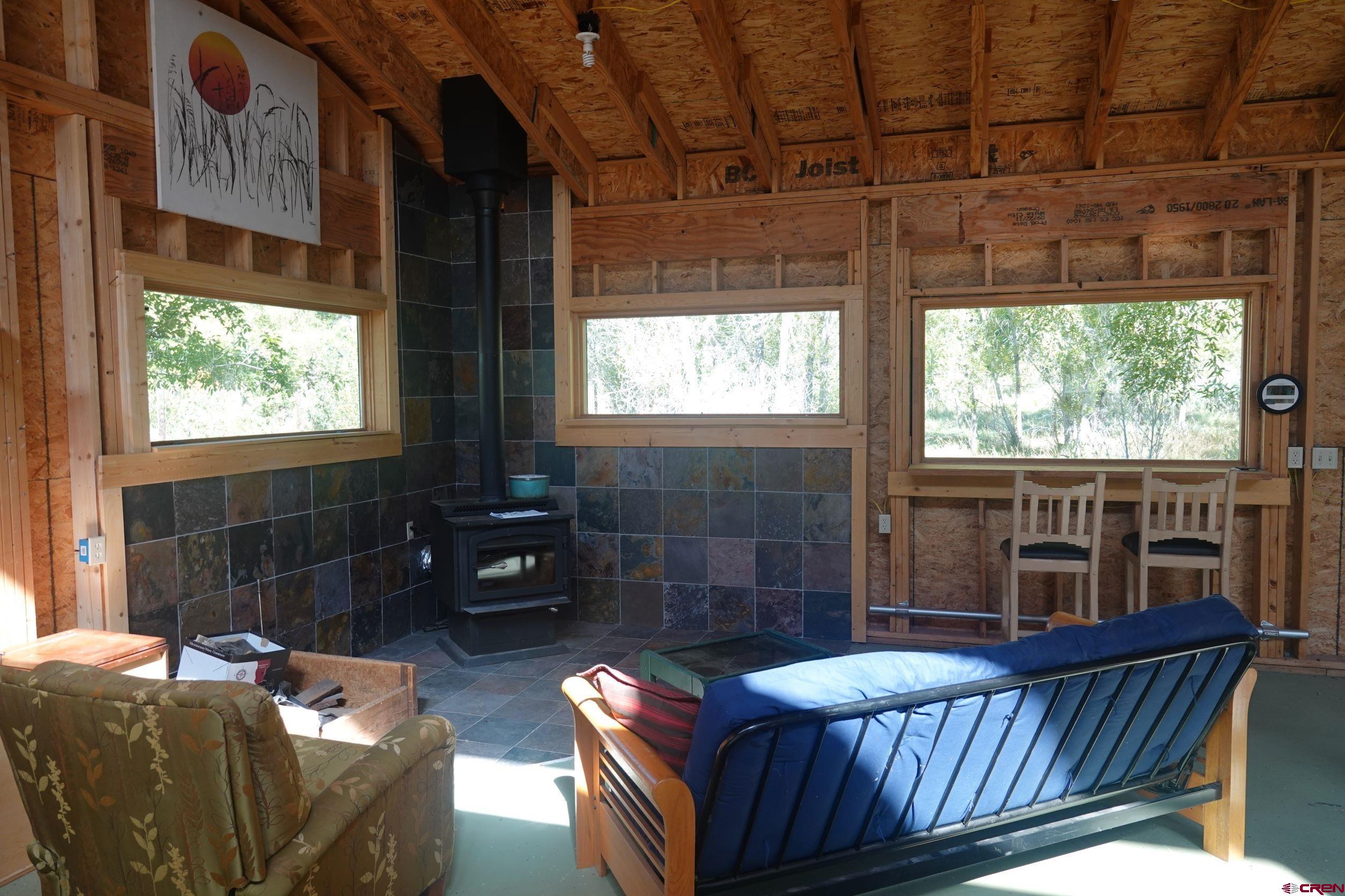 15835 Black Bridge Road Paonia, CO 81428 - Photo 29 of 35 a living room with furniture and a window
