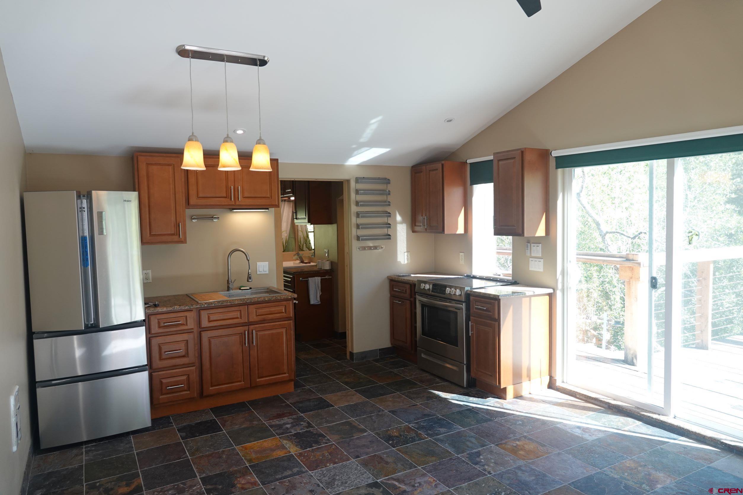 15835 Black Bridge Road Paonia, CO 81428 - Photo 32 of 35 a kitchen with a sink stainless steel appliances and cabinets