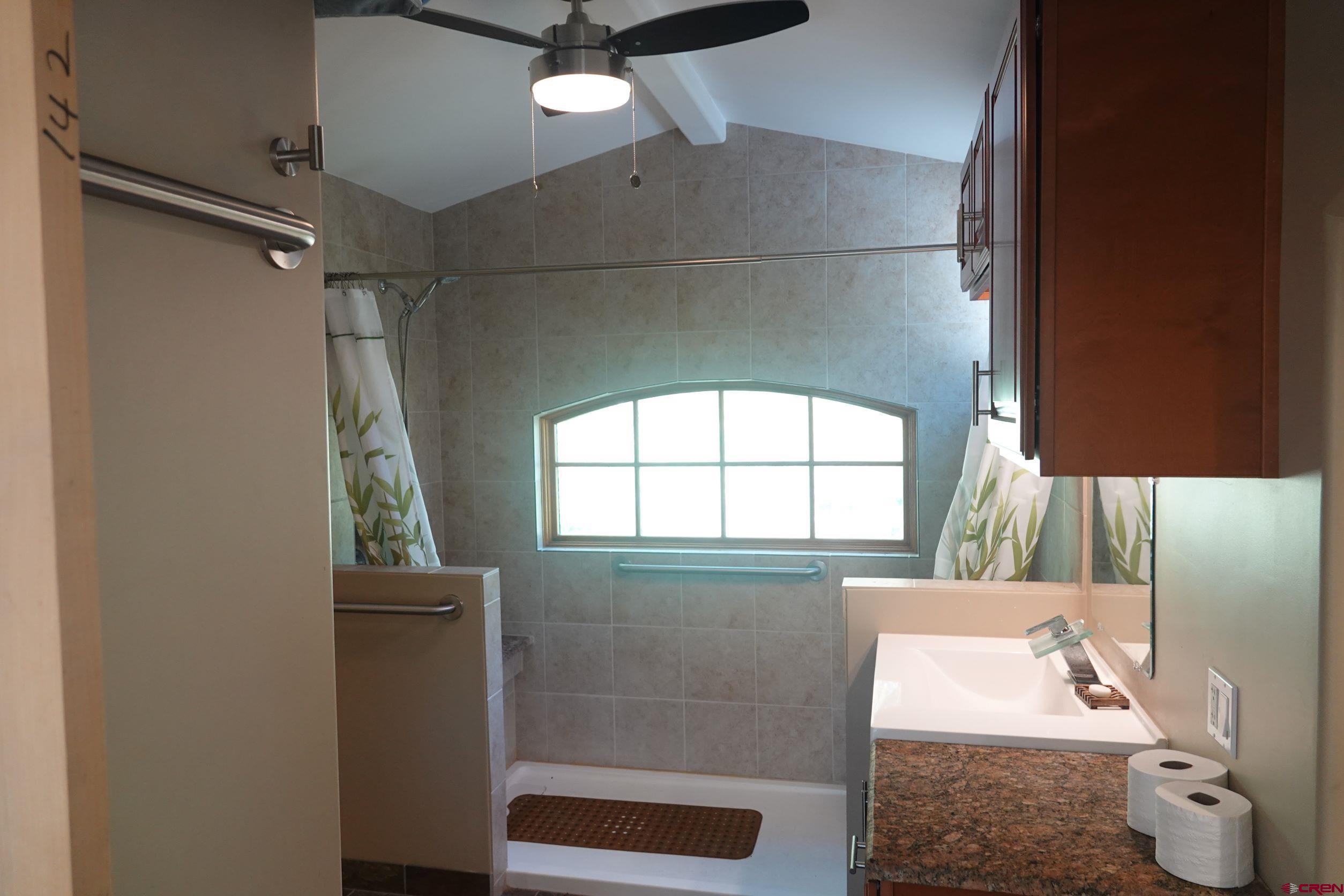 15835 Black Bridge Road Paonia, CO 81428 - Photo 34 of 35 a bathroom with a bathtub and shower