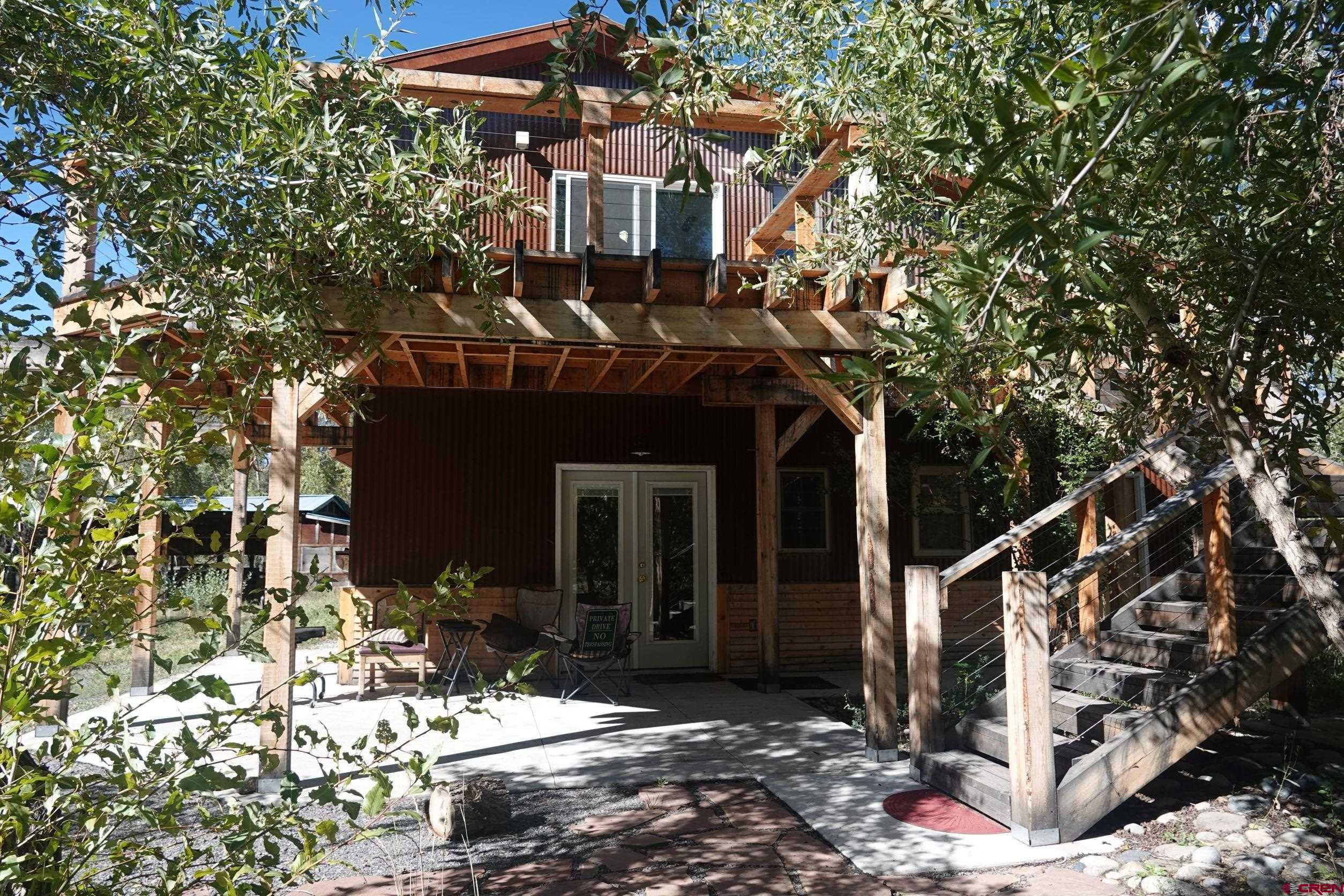 15835 Black Bridge Road Paonia, CO 81428 - Photo 35 of 35 a front view of a house with a tree