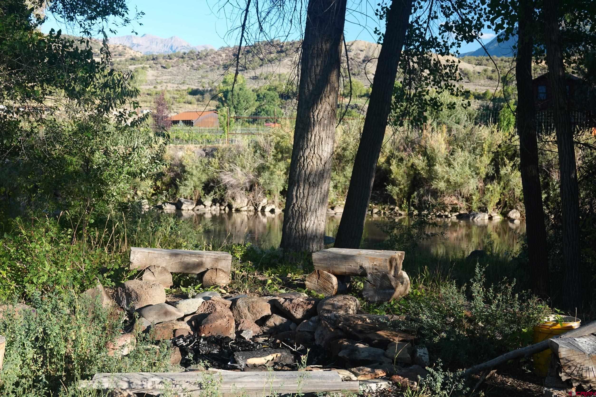 15835 Black Bridge Road Paonia, CO 81428 - Photo 5 of 35 a backyard of a house with lots of green space