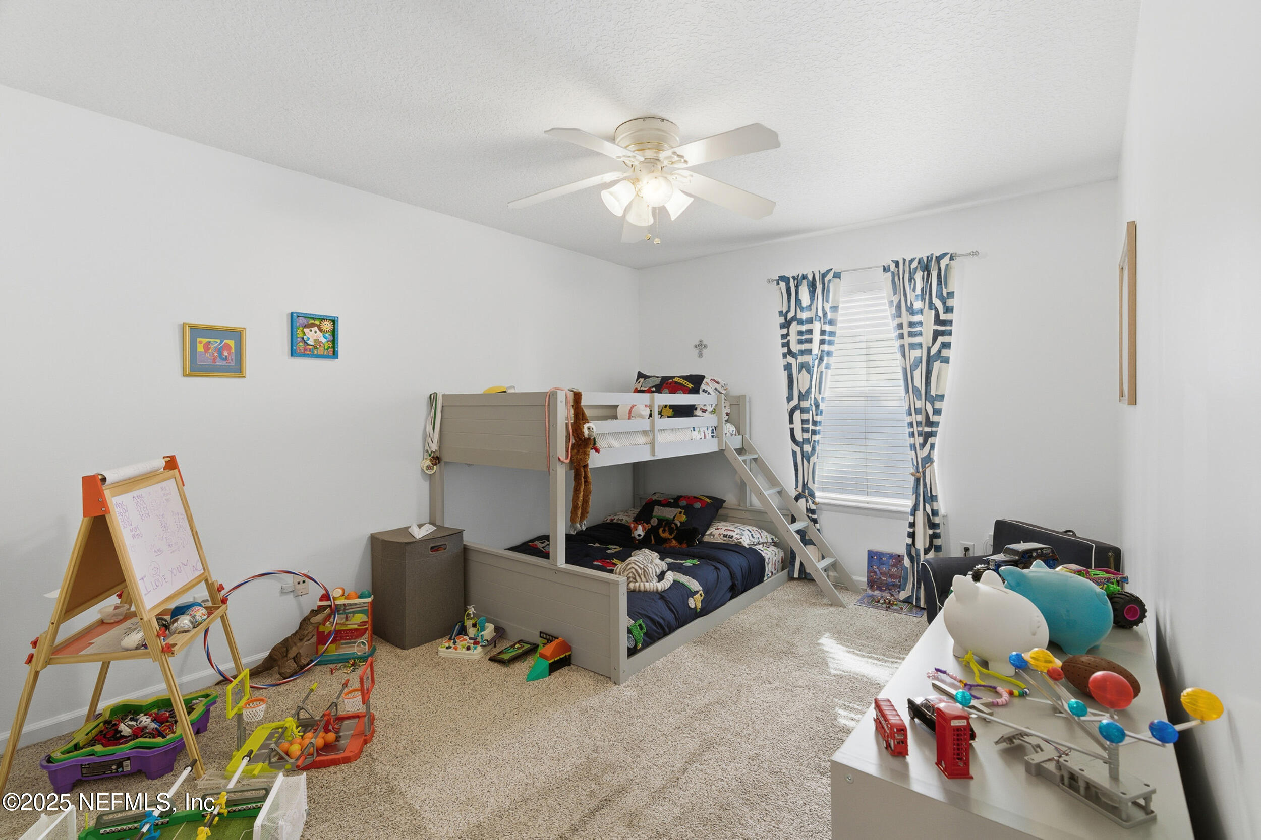 128 Seminole Road, Unit 11 Atlantic Beach, FL 32233 - Photo 13 of 26 a bedroom with furniture and a bed