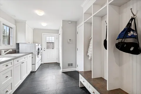 a kitchen with stainless steel appliances a refrigerator and a sink