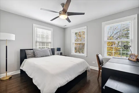 a bedroom with a bed and a table