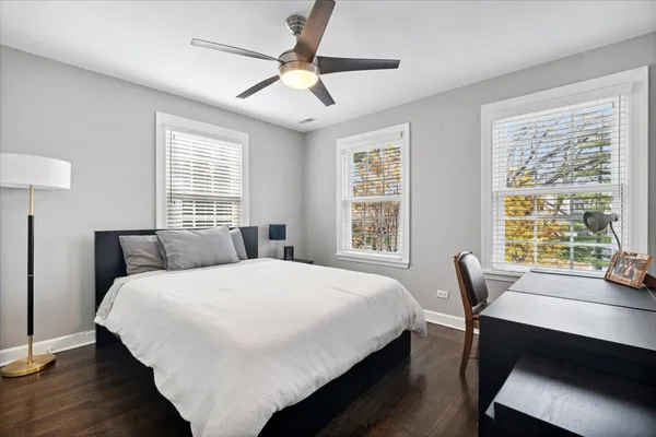 a bedroom with a bed and a table