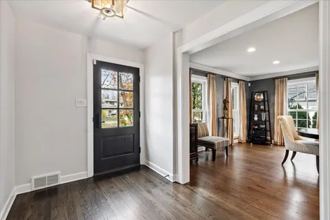a view of a livingroom with furniture and hardwood floor