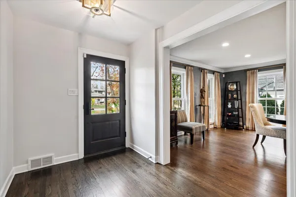 a view of a livingroom with furniture and hardwood floor