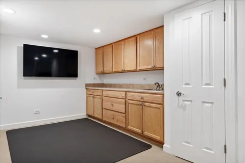 a kitchen with a sink and cabinets