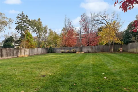 a backyard of a house with lots of green space