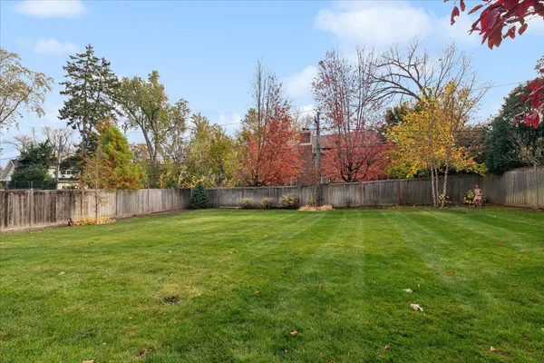 a backyard of a house with lots of green space