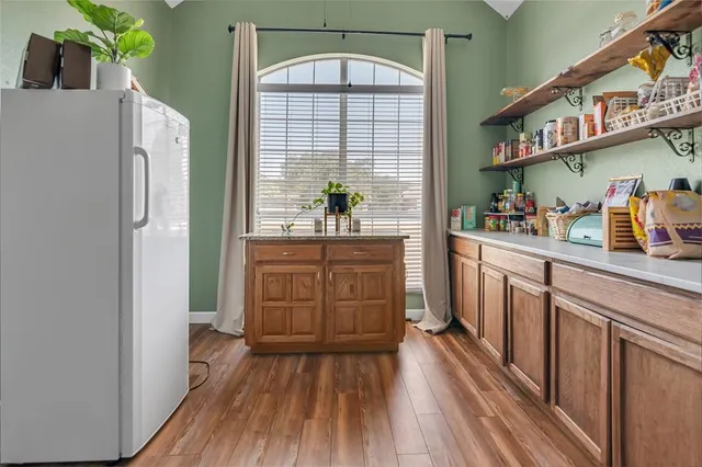 a kitchen with stainless steel appliances a refrigerator and a stove