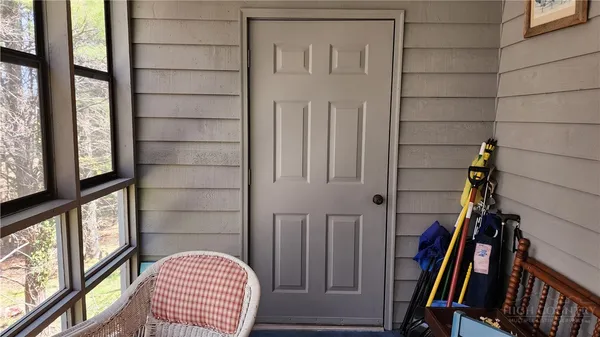 a view of an entryway with wooden floor