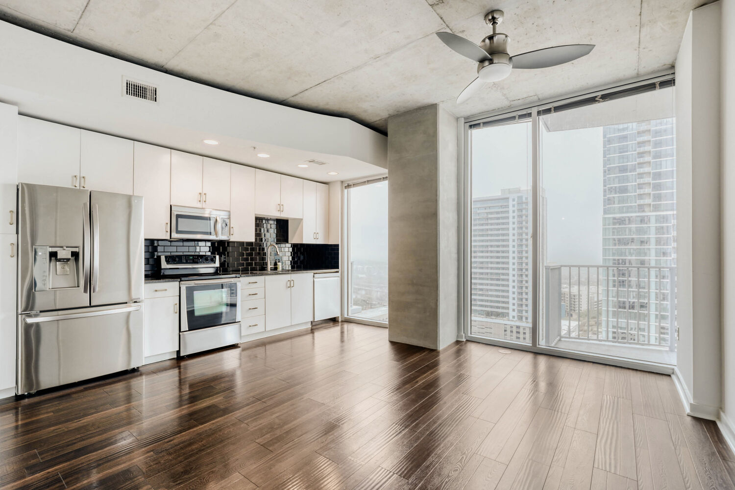 360 Nueces Street, Unit 2004 Austin, TX 78701 - Photo 15 of 34 a kitchen with stainless steel appliances a refrigerator sink and microwave