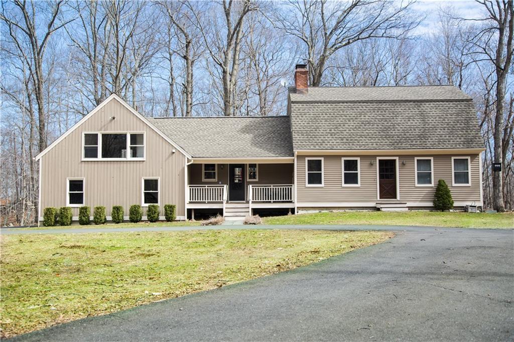 87 Ned's Mountain Road Ridgefield, CT 06877 - Photo 1 of 1 a front view of a house with a yard