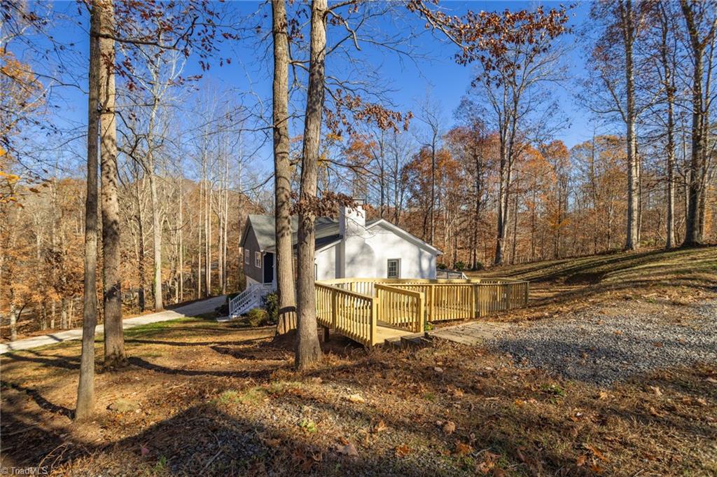 801 Hudson Road Summerfield, NC 27358 - Photo 6 of 50 New Walkway leads from upper parking area to the side Kitchen Door.
