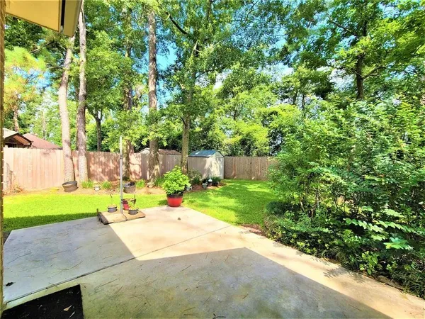 a front view of a house with yard and green space