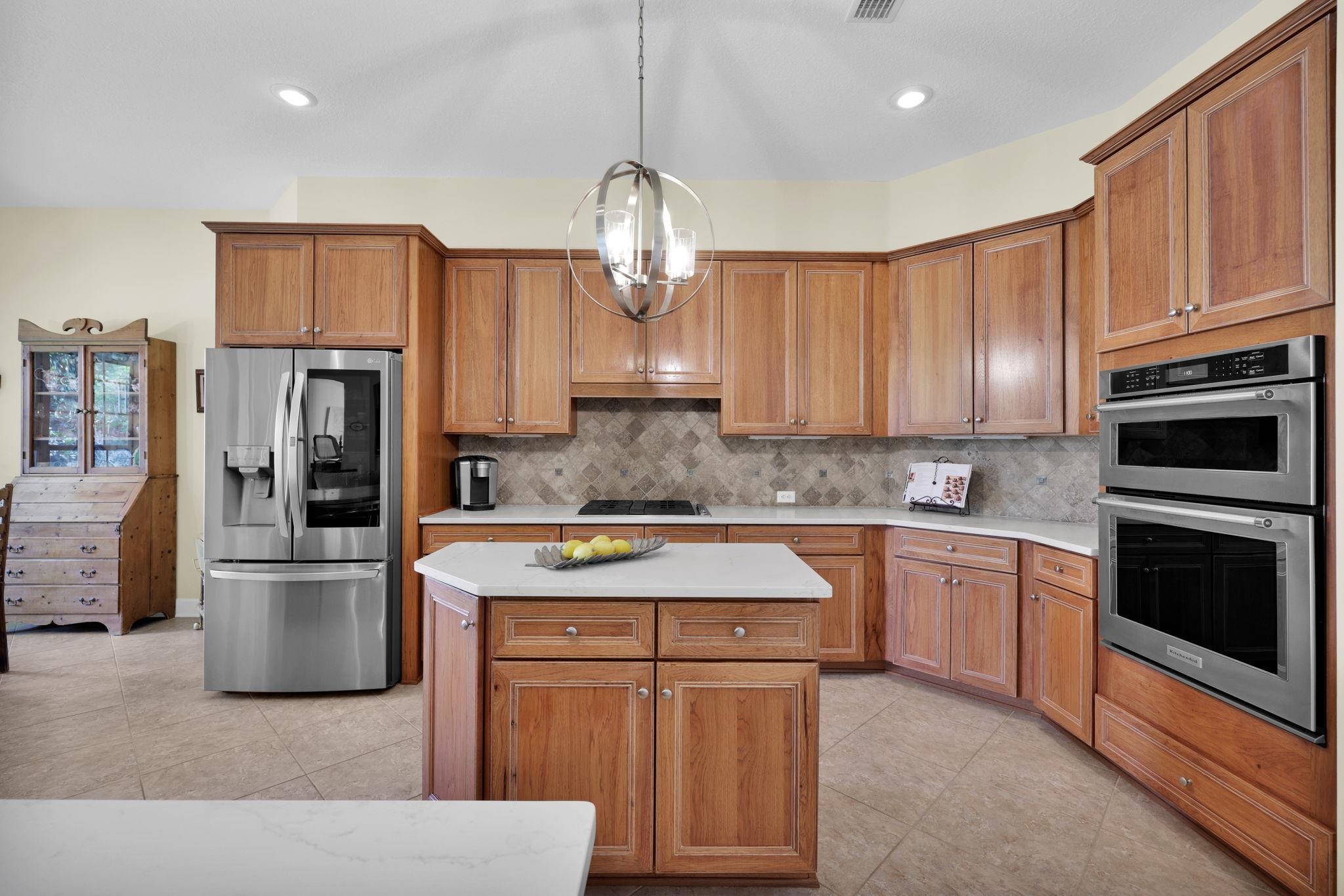 159 La Mesa Drive St. Augustine, FL 32095 - Photo 13 of 85 a kitchen with stainless steel appliances granite countertop a refrigerator a stove a sink and a refrigerator