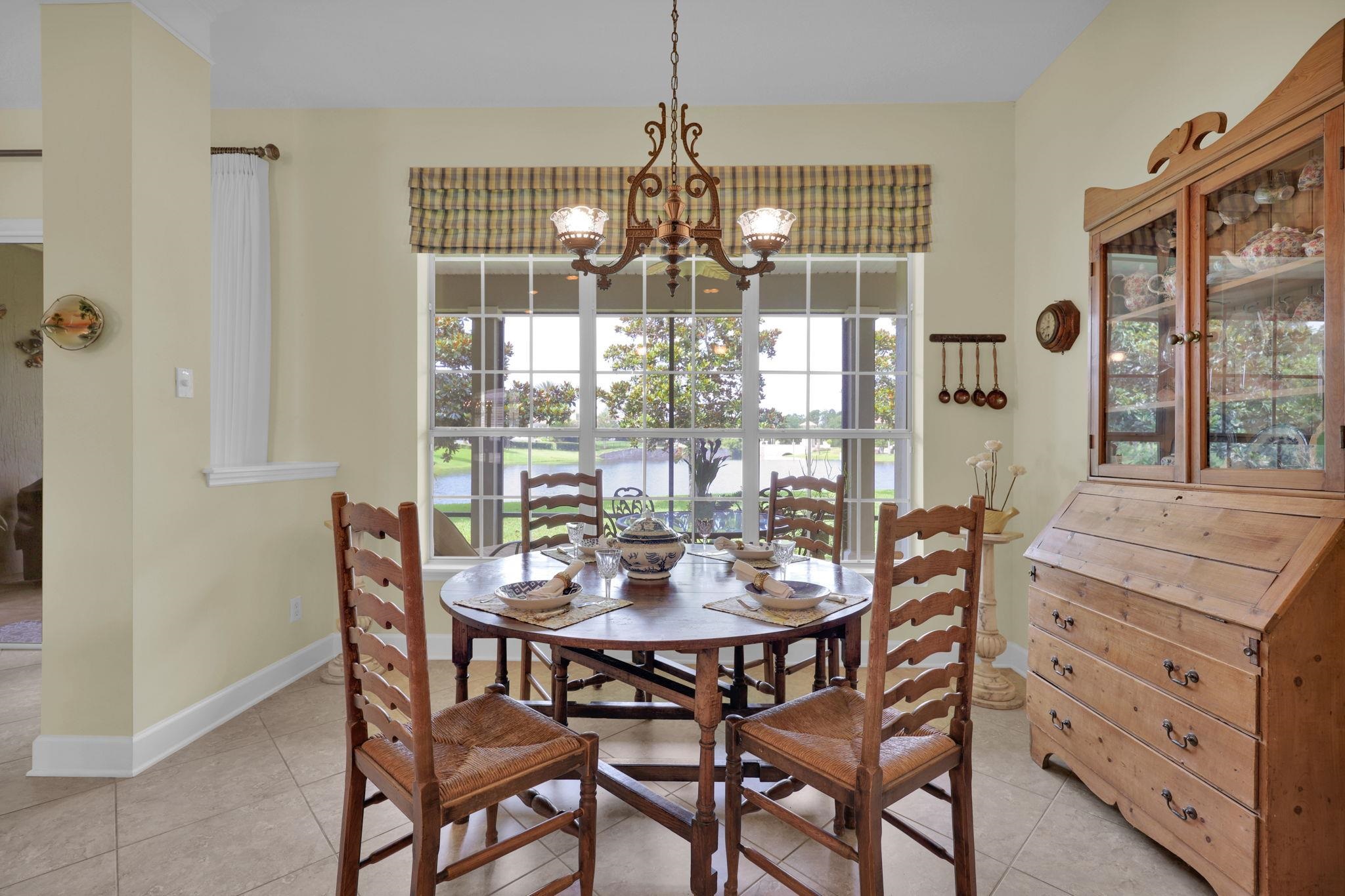 159 La Mesa Drive St. Augustine, FL 32095 - Photo 15 of 85 a dining room with furniture a chandelier and wooden floor