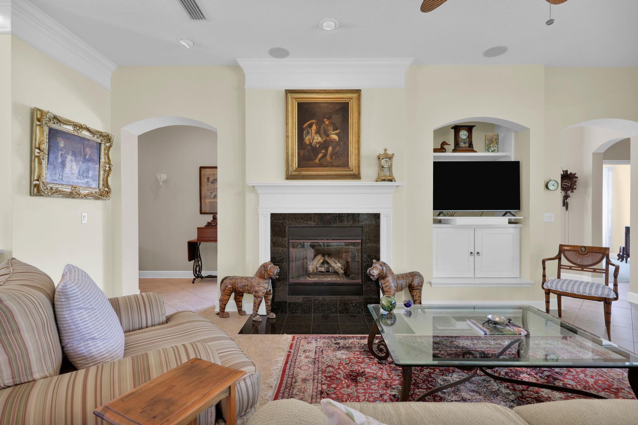 159 La Mesa Drive St. Augustine, FL 32095 - Photo 18 of 85 a living room with furniture a fireplace and a flat screen tv