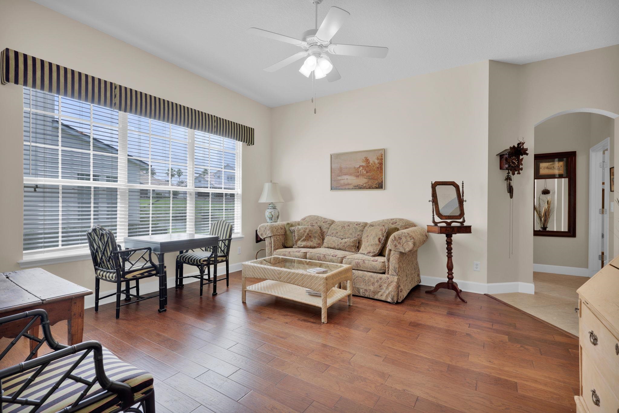 159 La Mesa Drive St. Augustine, FL 32095 - Photo 22 of 85 a living room with furniture and wooden floor
