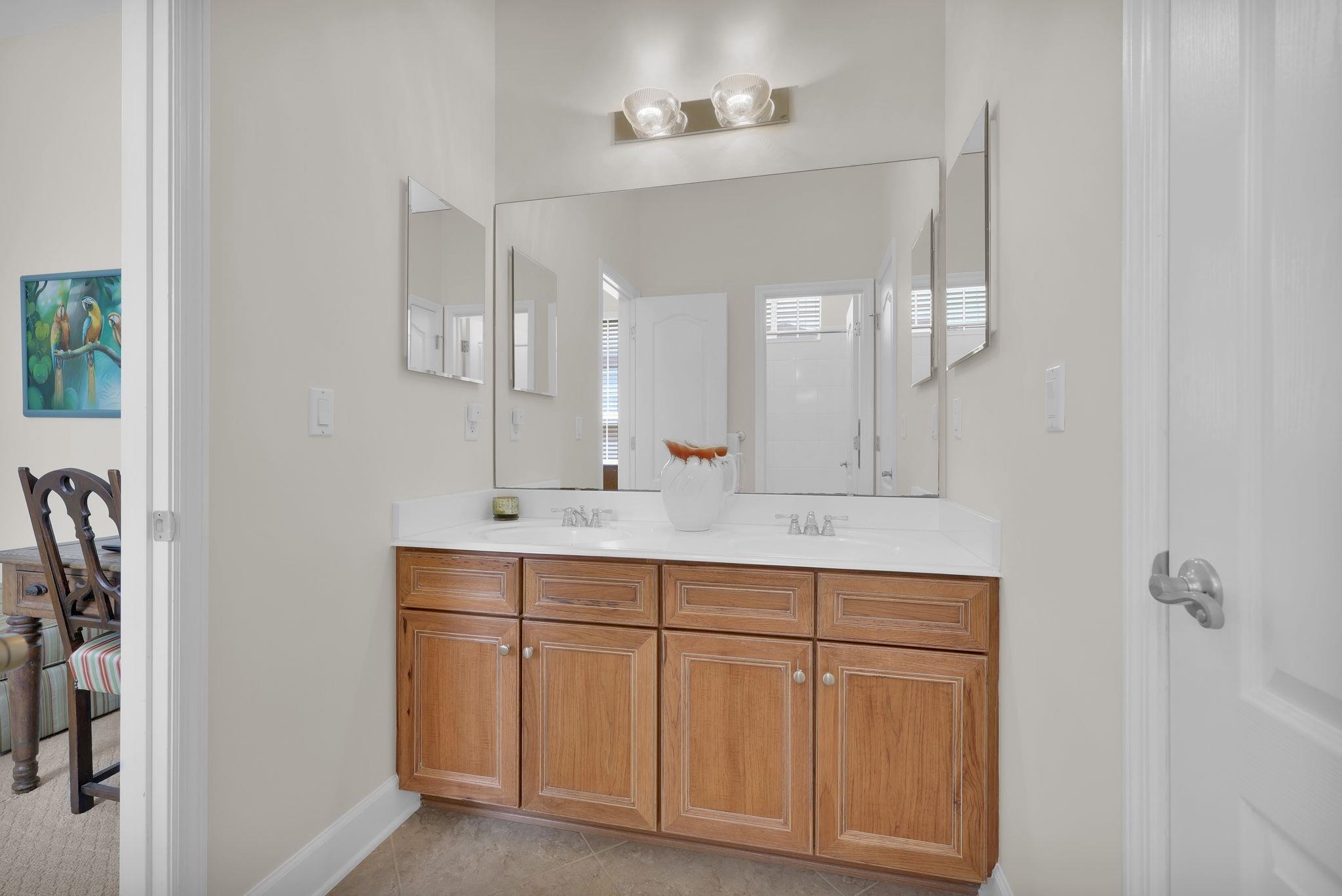 159 La Mesa Drive St. Augustine, FL 32095 - Photo 26 of 85 a bathroom with a double vanity sink and mirror