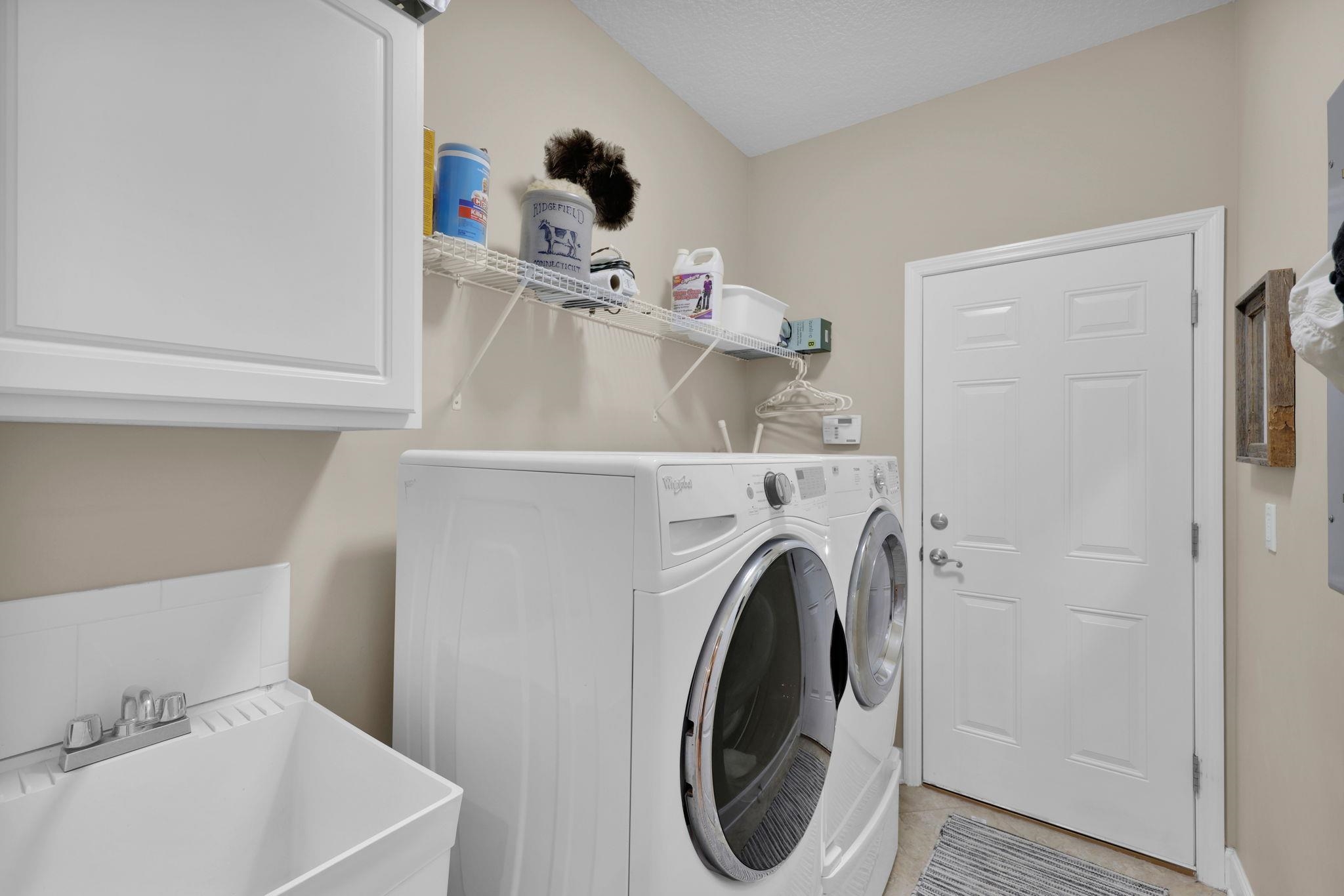 159 La Mesa Drive St. Augustine, FL 32095 - Photo 32 of 85 a utility room with dryer and washer