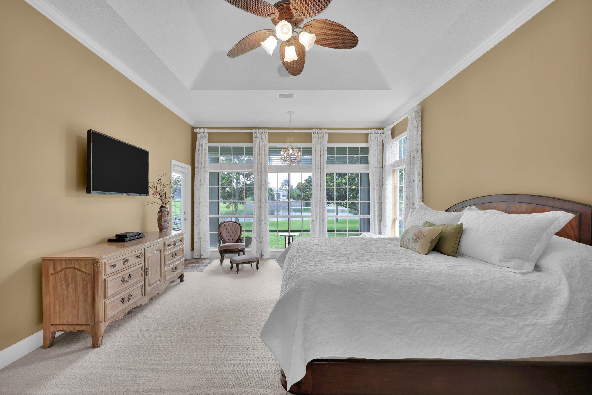 159 La Mesa Drive St. Augustine, FL 32095 - Photo 33 of 85 a bedroom with a bed and a flat tv screen on the dresser
