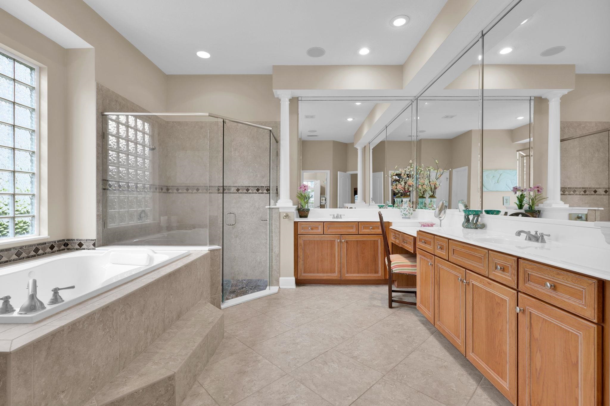 159 La Mesa Drive St. Augustine, FL 32095 - Photo 39 of 85 a bathroom with a tub a sink double vanity and a shower