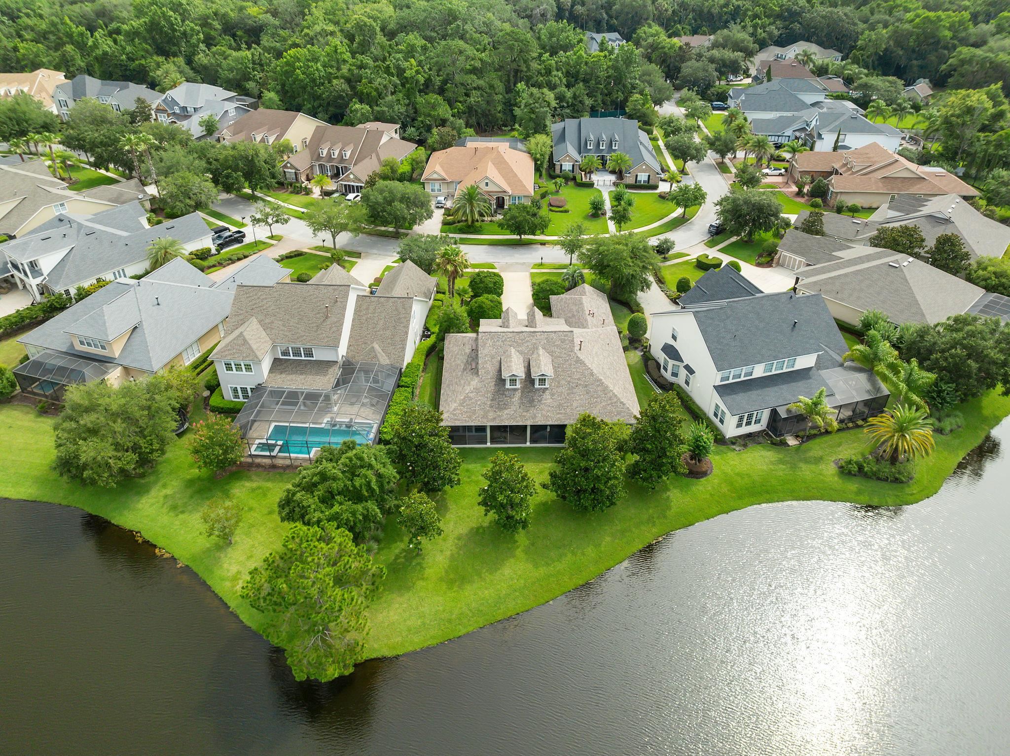 159 La Mesa Drive St. Augustine, FL 32095 - Photo 54 of 85 an aerial view of a house with a garden and lake view