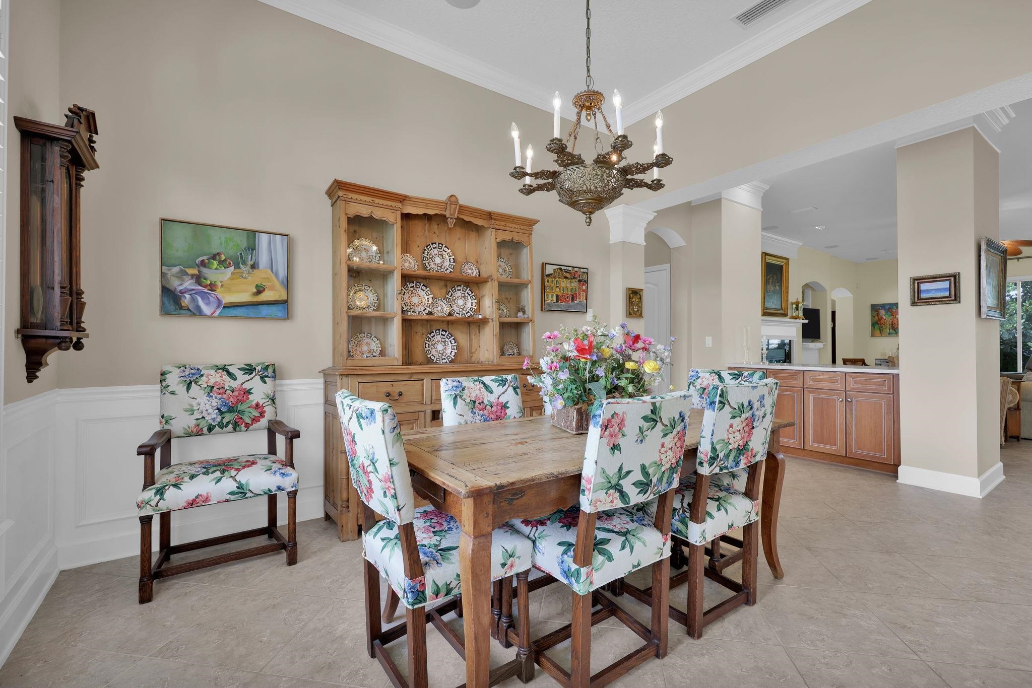 159 La Mesa Drive St. Augustine, FL 32095 - Photo 9 of 85 a view of a dining room with furniture and chandelier