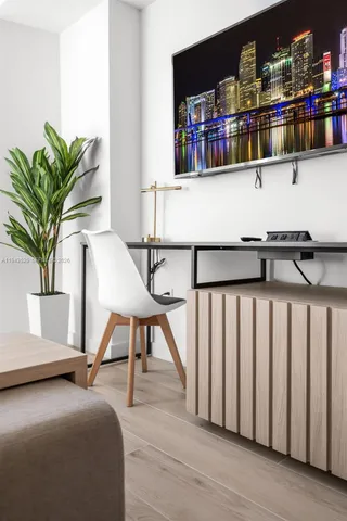 a view of workspace with furniture and potted plant