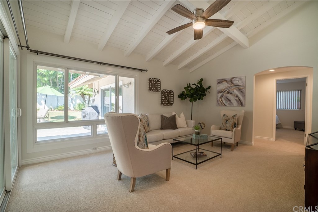 1001 Castlegate Lane North Tustin, CA 92705 - Photo 14 of 30 family room overlooking backyard patio, pool and lawn area.