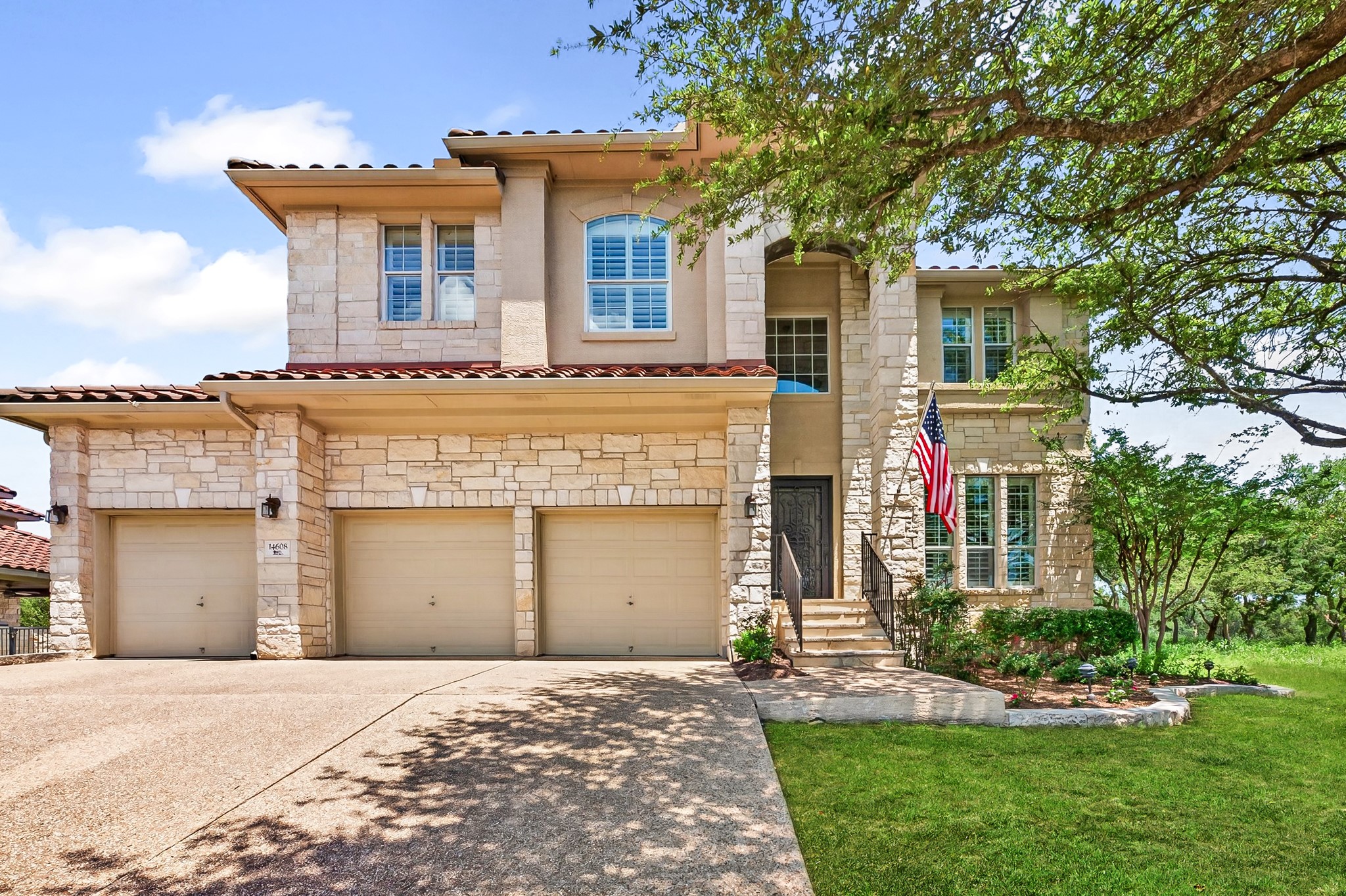 14608 Spillman Ranch Loop Austin, TX 78738 - Photo 1 of 31 front view of a house with a yard