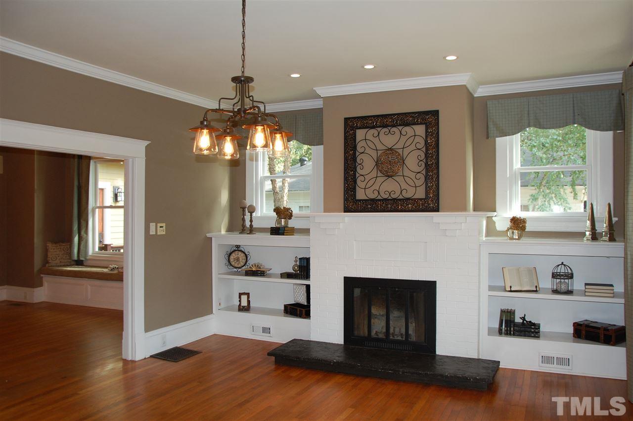 1614 Scales Street Raleigh, NC 27608 - Photo 4 of 25 a living room with furniture and a fireplace