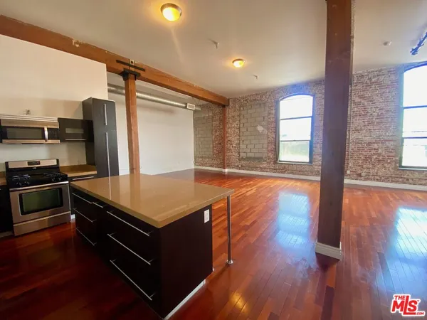 a room with wooden floor and furniture