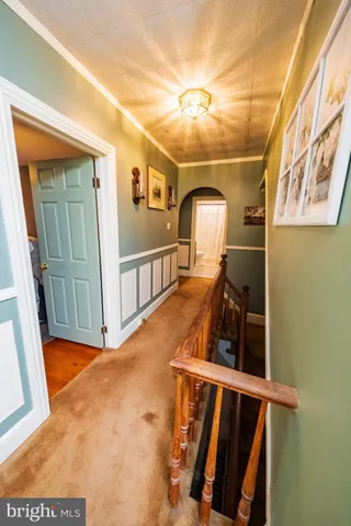 a bedroom with a bed dresser and a window