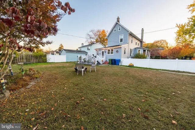 a front view of a house with a garden and patio