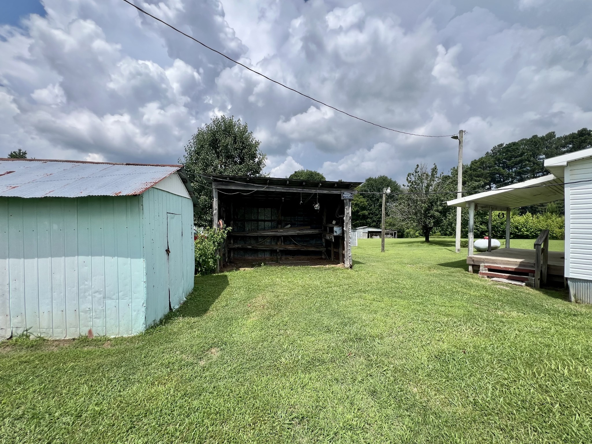 3467 Fall River Road Pulaski, TN 38478 - Photo 20 of 38 a view of backyard with barbeque grill and a small yard