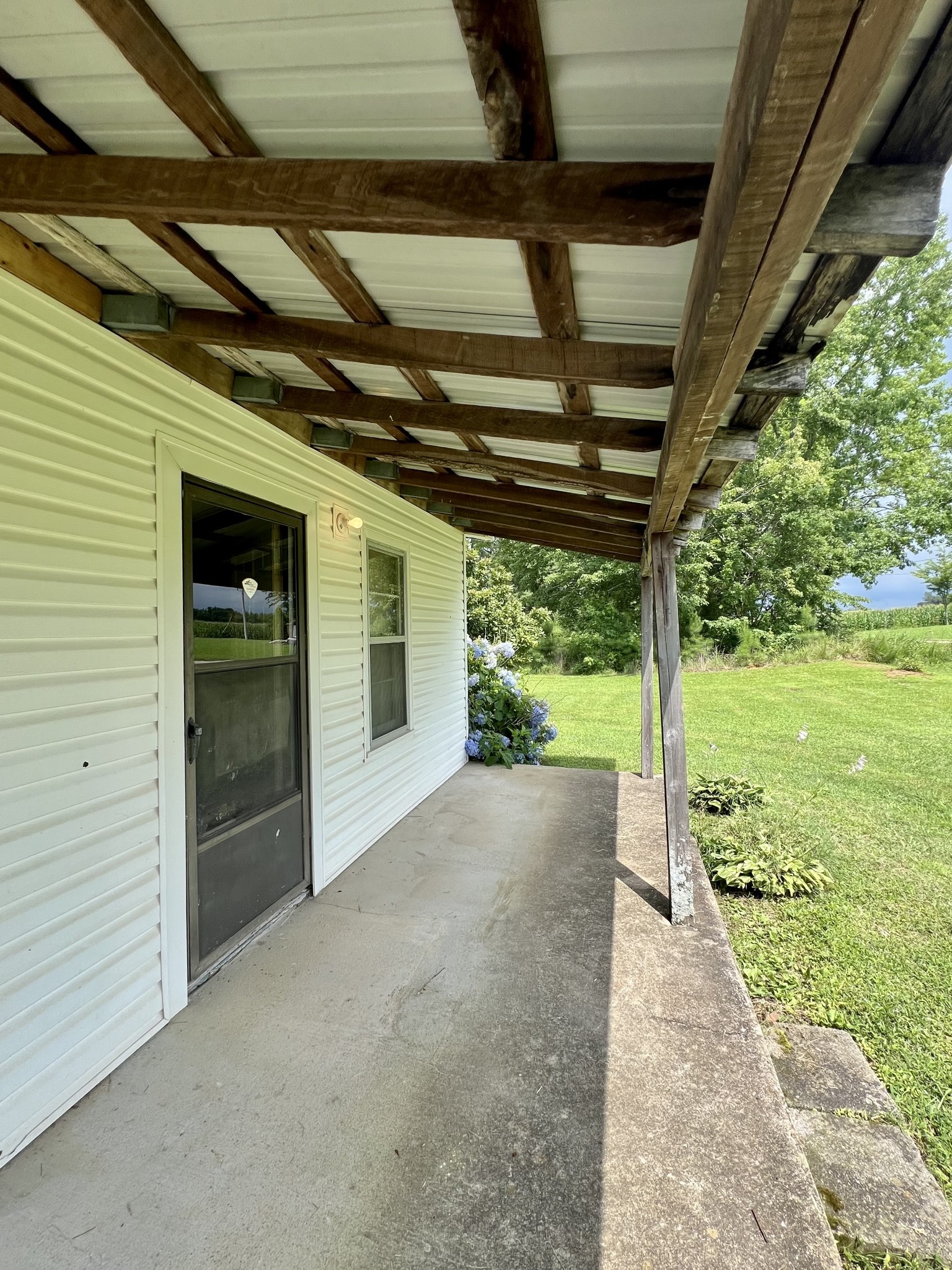 3467 Fall River Road Pulaski, TN 38478 - Photo 29 of 38 a view of a house with backyard and porch