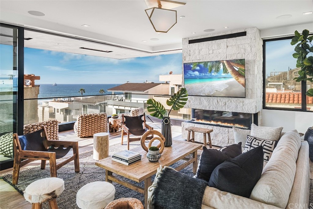 200 40th Street Manhattan Beach, CA 90266 - Photo 14 of 57 a living room with furniture a rug and white walls