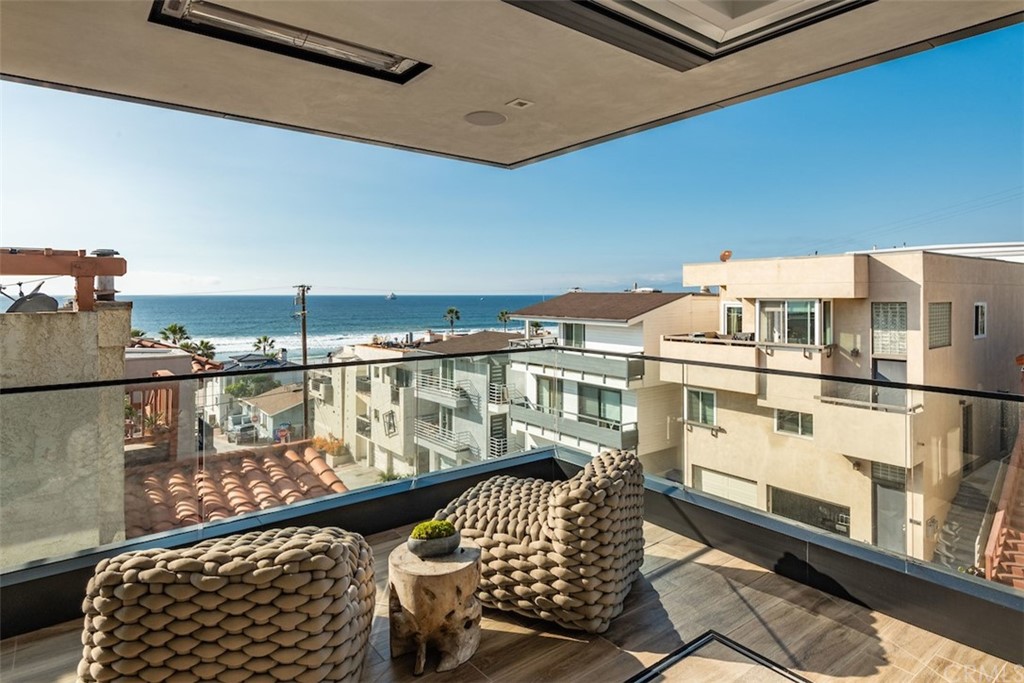 200 40th Street Manhattan Beach, CA 90266 - Photo 16 of 57 a balcony view with two chairs and a table