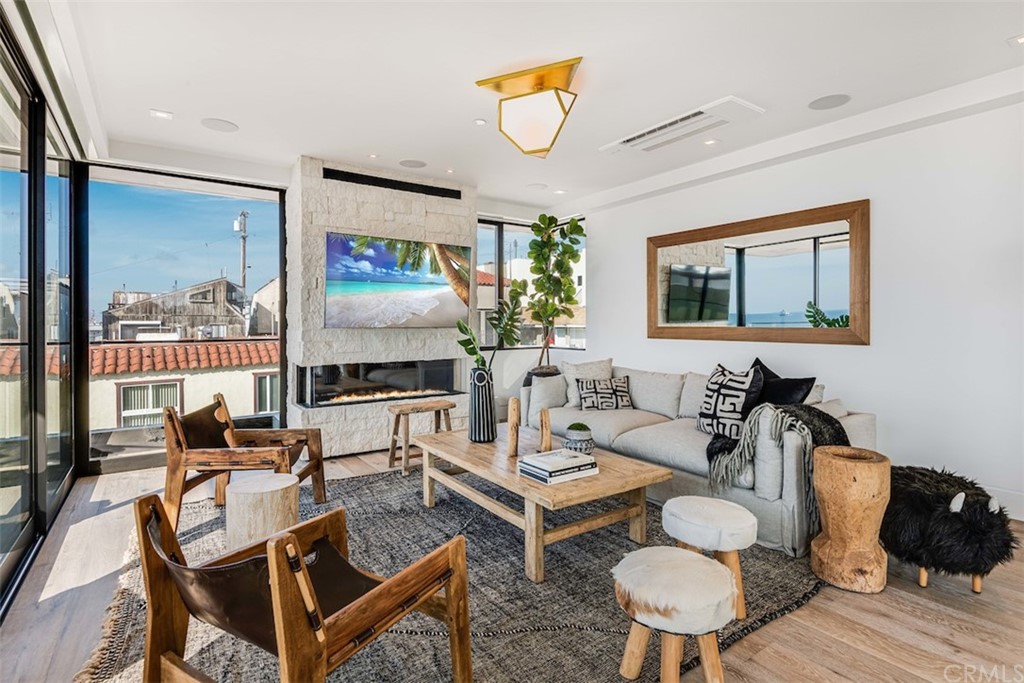 200 40th Street Manhattan Beach, CA 90266 - Photo 17 of 57 a living room with furniture and a flat screen tv