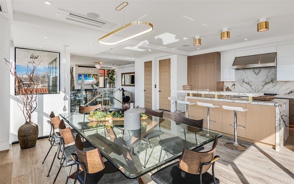 200 40th Street Manhattan Beach, CA 90266 - Photo 19 of 57 a view of a dining room with furniture and wooden floor