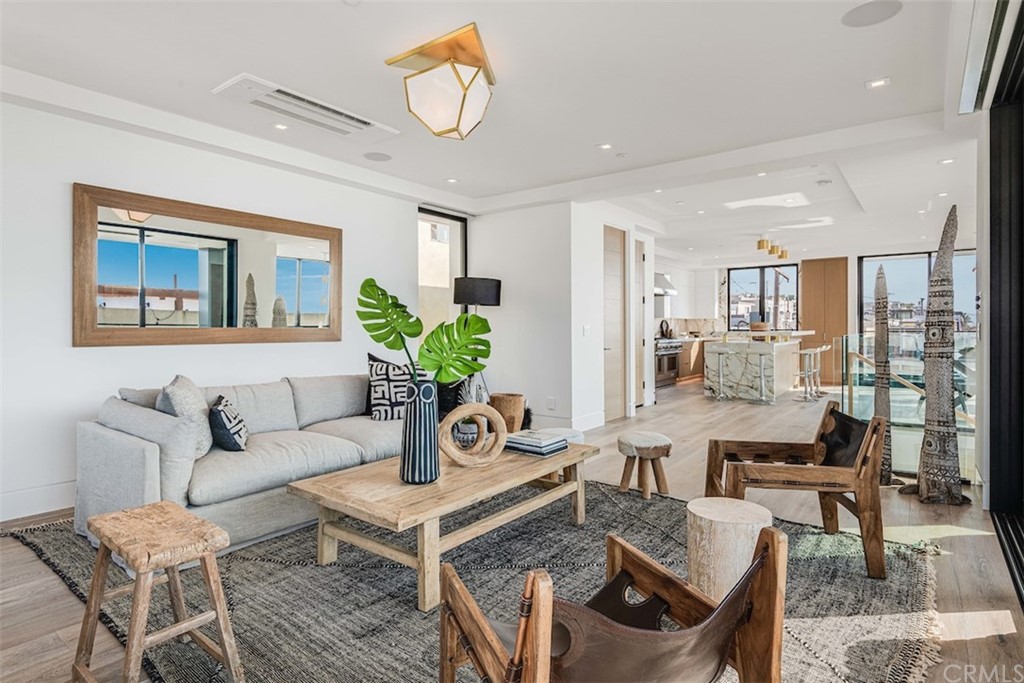 200 40th Street Manhattan Beach, CA 90266 - Photo 24 of 57 a living room with furniture and a table