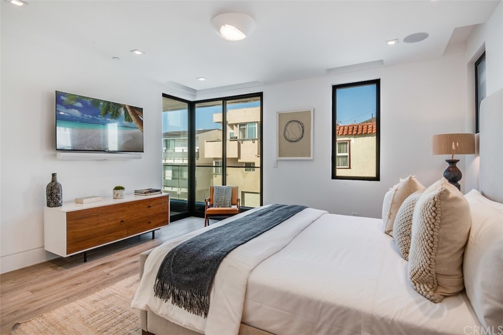 200 40th Street Manhattan Beach, CA 90266 - Photo 30 of 57 a bedroom with a bed and a flat screen tv